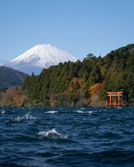 Lake Ashi with Mount Fuji and Hakone Shrine torii in the distance